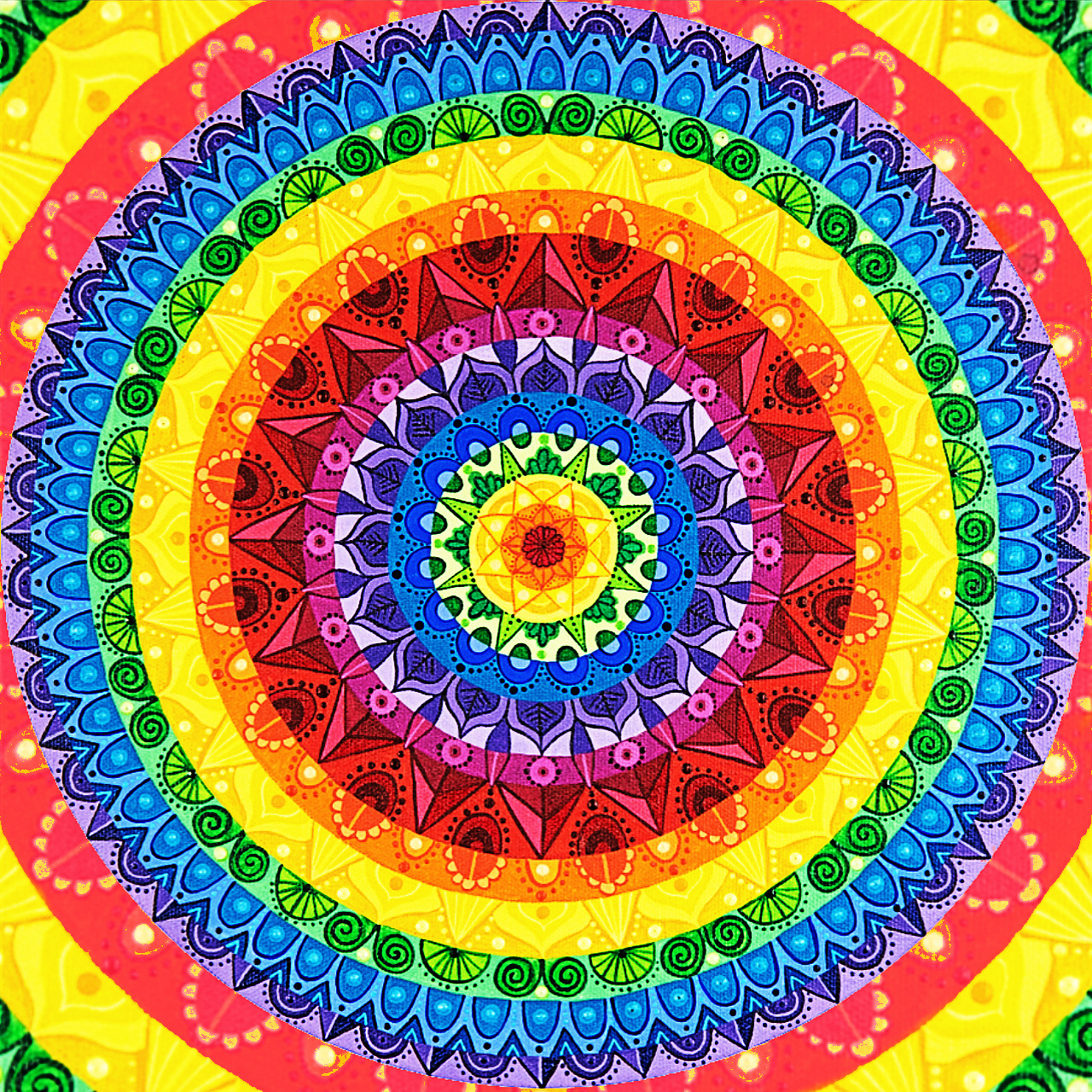 Colorful circular mandala with rainbow concentric rings and detailed geometric patterns radiating from yellow center
