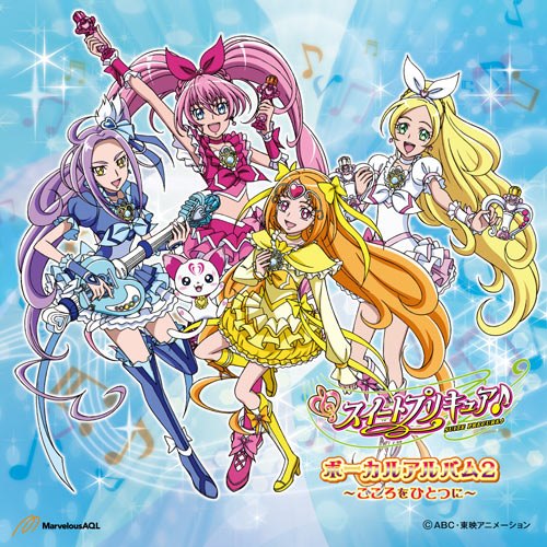 Anime illustration of four magical girls in colorful dresses on a sparkling blue background