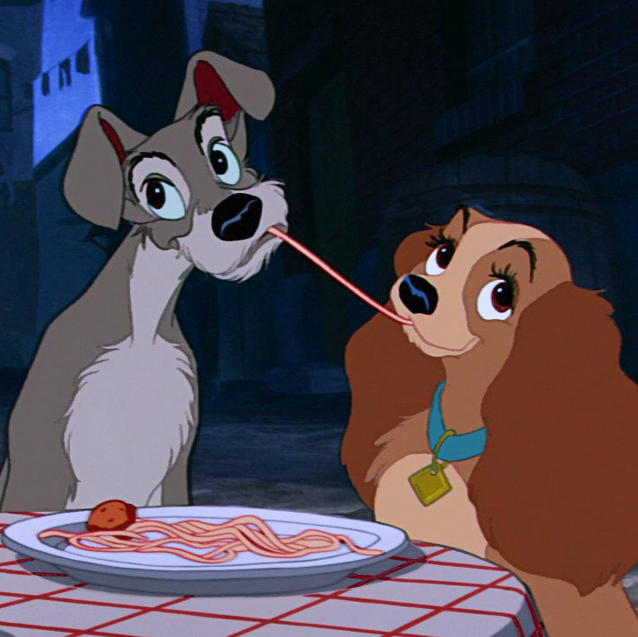 Lady and Tramp cartoon dogs sharing spaghetti at a table