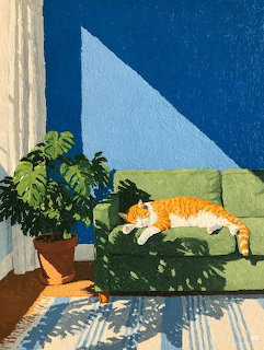 Orange cat resting on green chair beside potted plant with sunlight and shadows