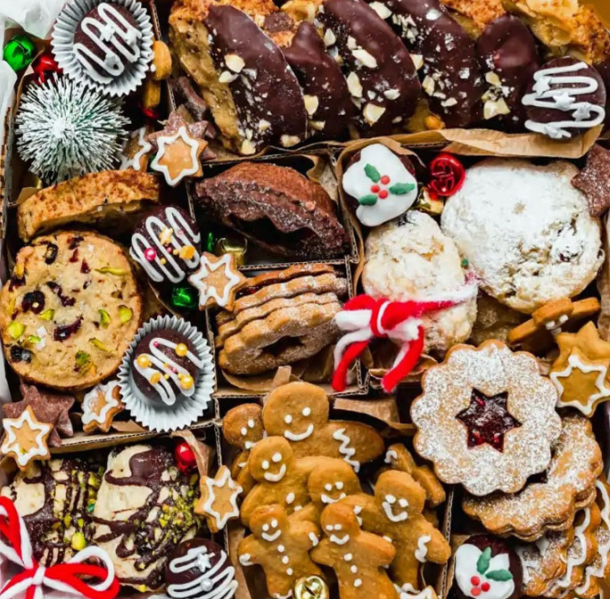 Assorted Christmas cookies and gingerbread treats arranged in a festive display