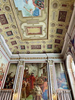Ornate palace interior with decorated ceiling, columns and wall frescoes in Porto, Portugal