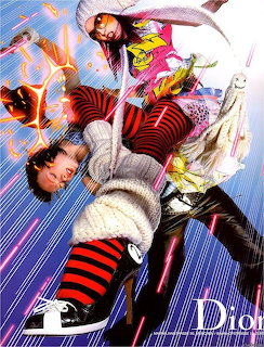 Fashion model in avant-garde layered outfit with red and black striped tights against colorful graphic background