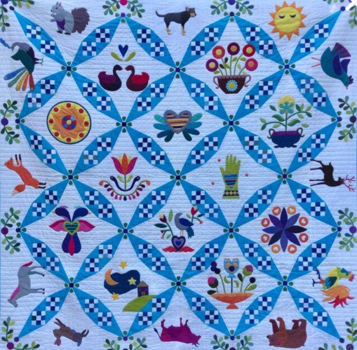 Blue patchwork quilt illustration with birds, flowers, animals, and geometric diamond patterns