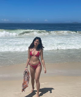 Woman in Red Bikini on Beach