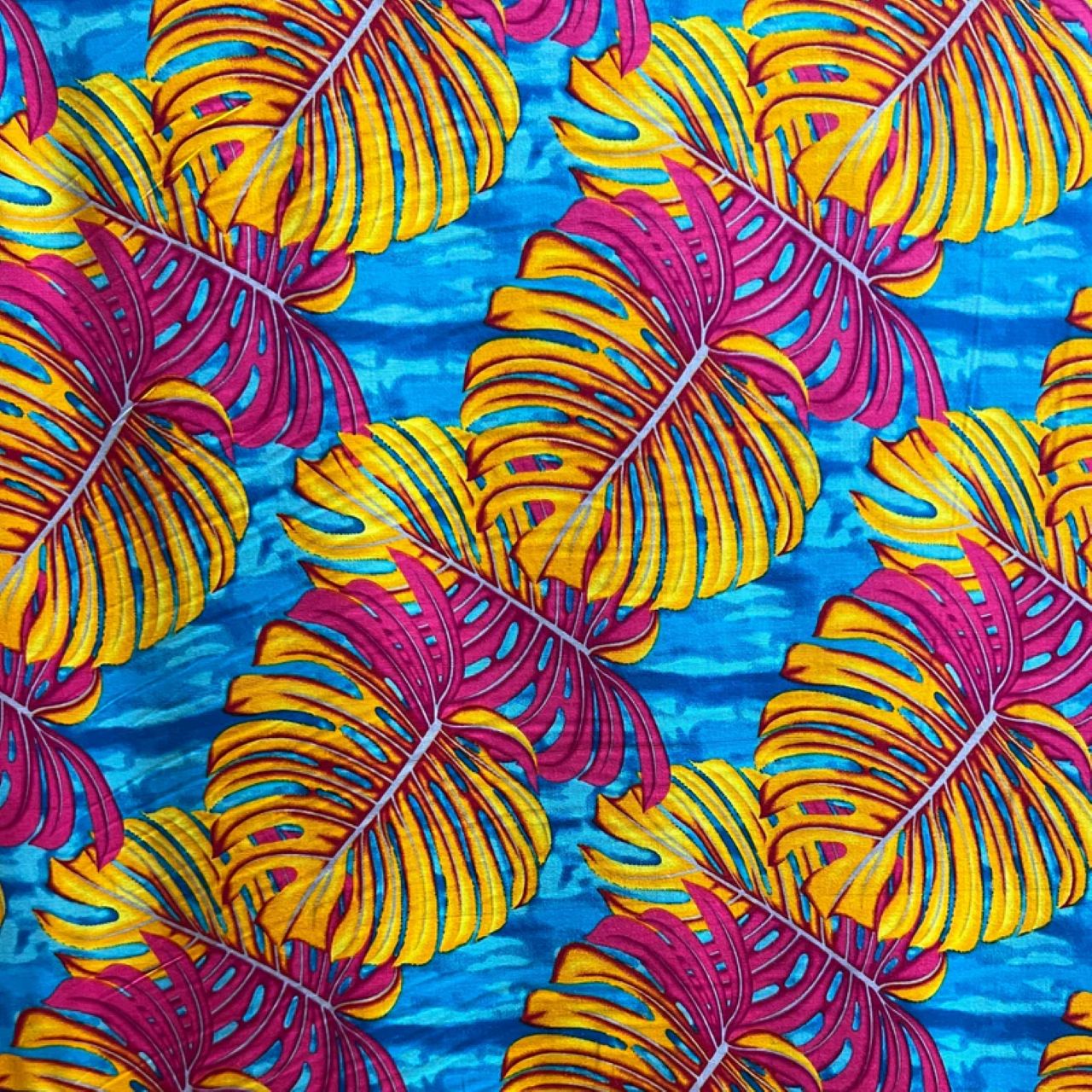 Colorful abstract monstera leaf pattern with yellow and pink leaves on turquoise background