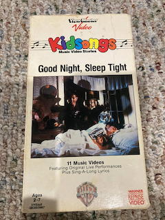 Kidsongs Good Night Sleep Tight VHS tape lying on a gray carpet