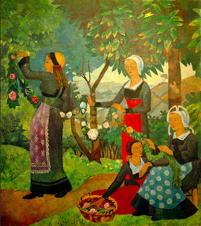 Three women in traditional dress gather around a rose garland in a garden with flowering trees