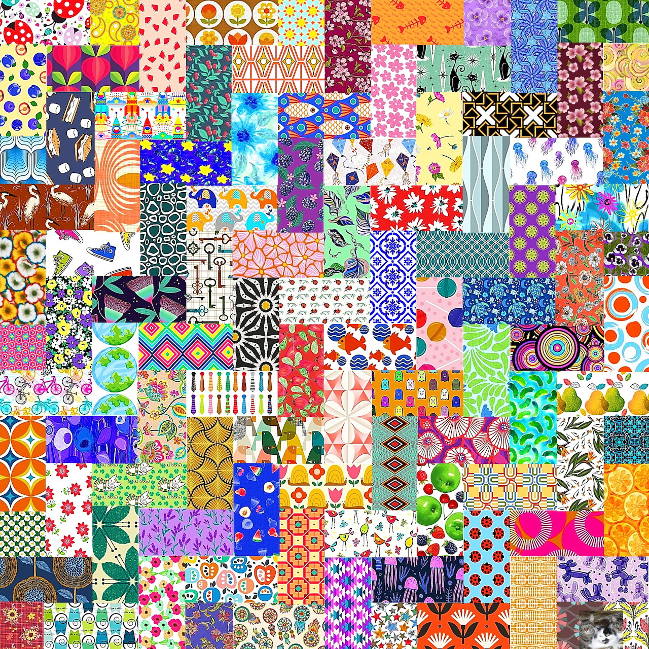 Colorful patchwork quilt made of many small squares with diverse patterns including flowers, dots, stripes, and geometric designs