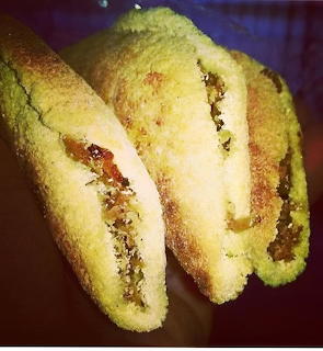Three stuffed fried sandwiches with savory filling in close-up