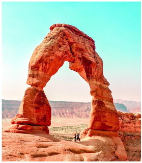 Delicate Arch natural sandstone formation in Arches National Park with desert landscape in background