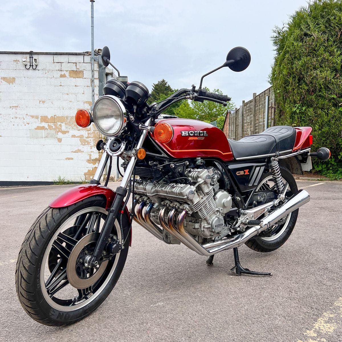 Red Honda CBX1000 motorcycle parked outdoors on pavement