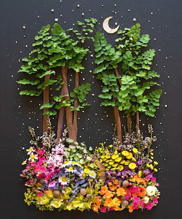 3D paper art of green trees and vibrant flowers under night sky with moon and stars