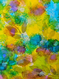 Abstract alcohol ink art with vibrant yellow, turquoise, purple and green fluid patterns and circular stenciled shapes