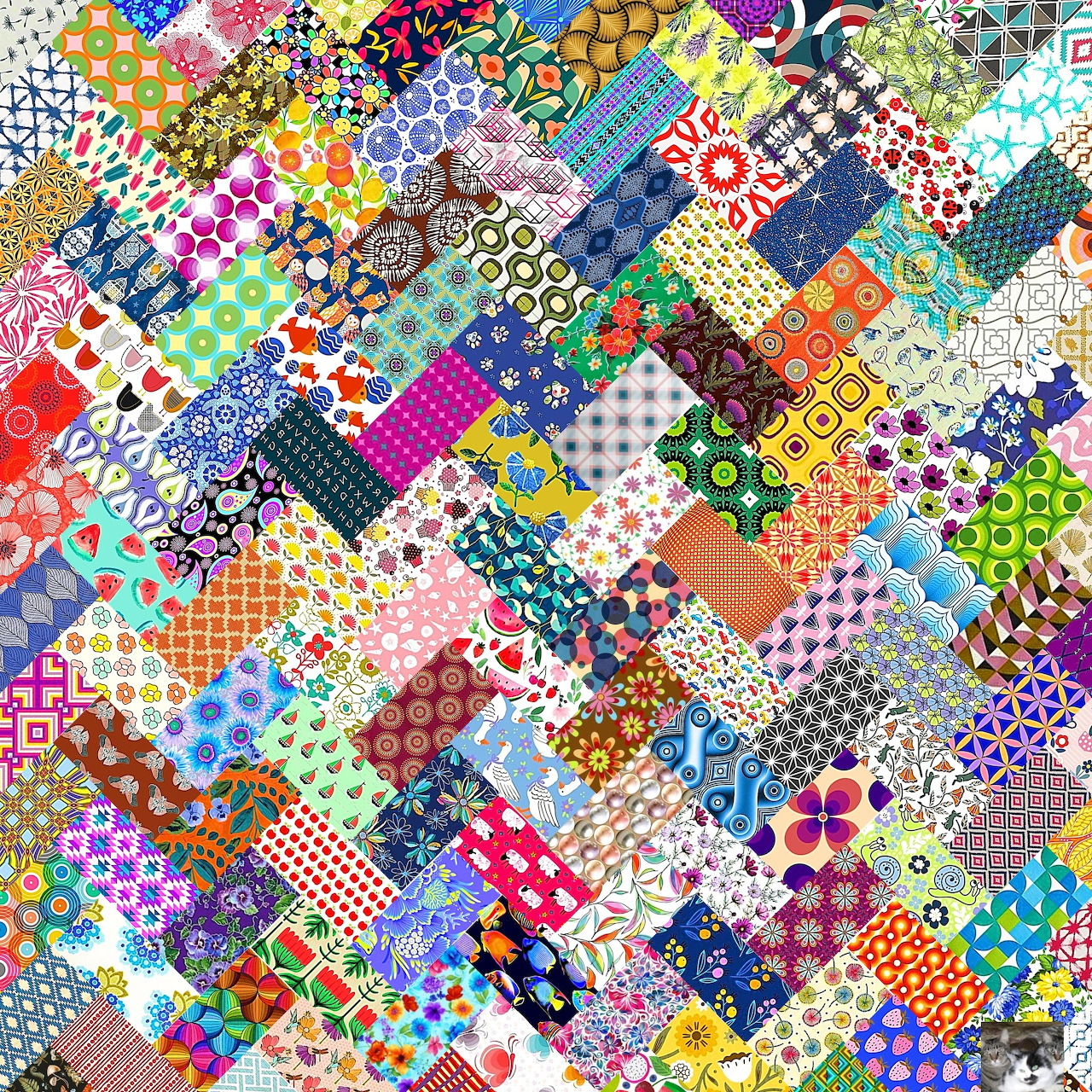 Colorful patchwork quilt with hundreds of varied fabric squares in floral, geometric, and polka dot patterns
