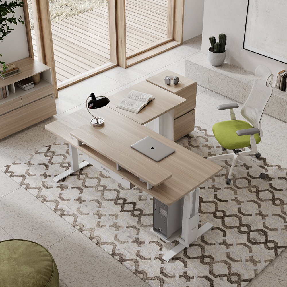 Modern home office with wooden desk, green chair, and patterned rug viewed from above