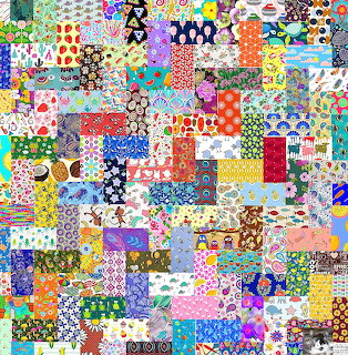 Dense patchwork quilt made of many small colorful fabric squares with various patterns including flowers, dots, and geometric shapes