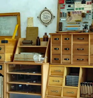 Collection of wooden desk organizers and vintage office storage units with drawers and compartments