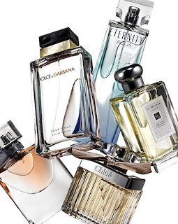 Several luxury perfume bottles including Dolce & Gabbana, Calvin Klein Eternity, Chloé, and Jo Malone