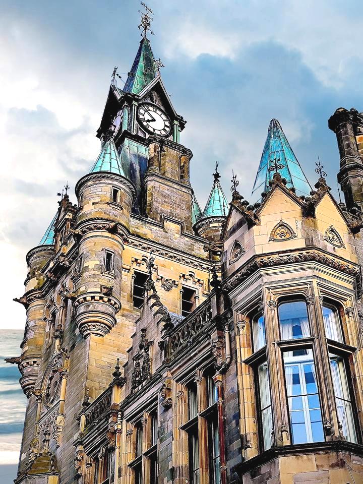 Ornate stone facade of a historic City Chambers building with classical architecture