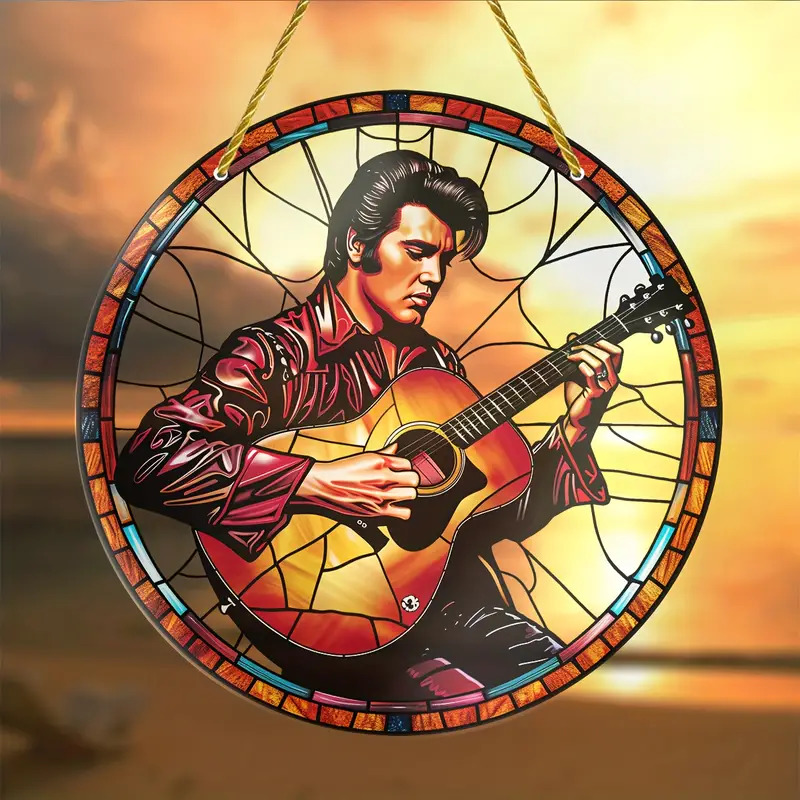 Stained glass circular artwork of Elvis Presley holding a guitar against a colorful sunset sky