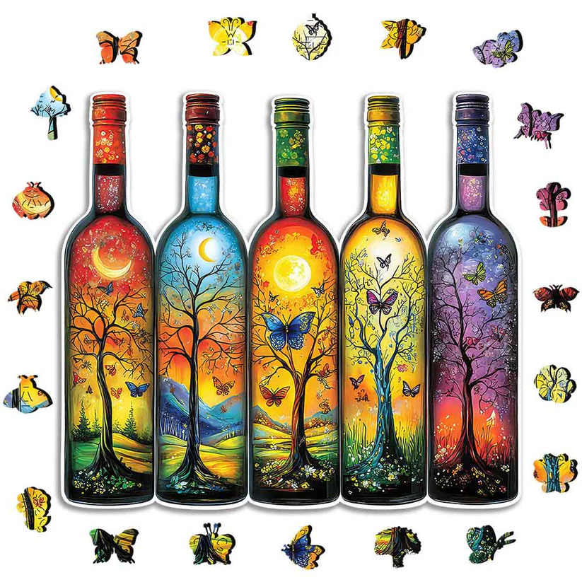 Five painted glass bottles with colorful tree scenes, surrounded by small butterflies on white