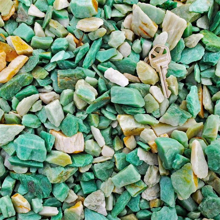 Collection of smooth tumbled sea glass stones in green, white and amber colors