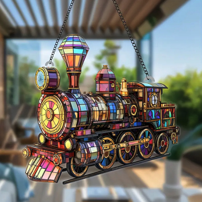Decorative stained glass train ornament with vibrant multicolored mosaic patterns hanging by chains
