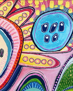 Colorful abstract art with large blue buttons, pink ribbons, and yellow starburst patterns