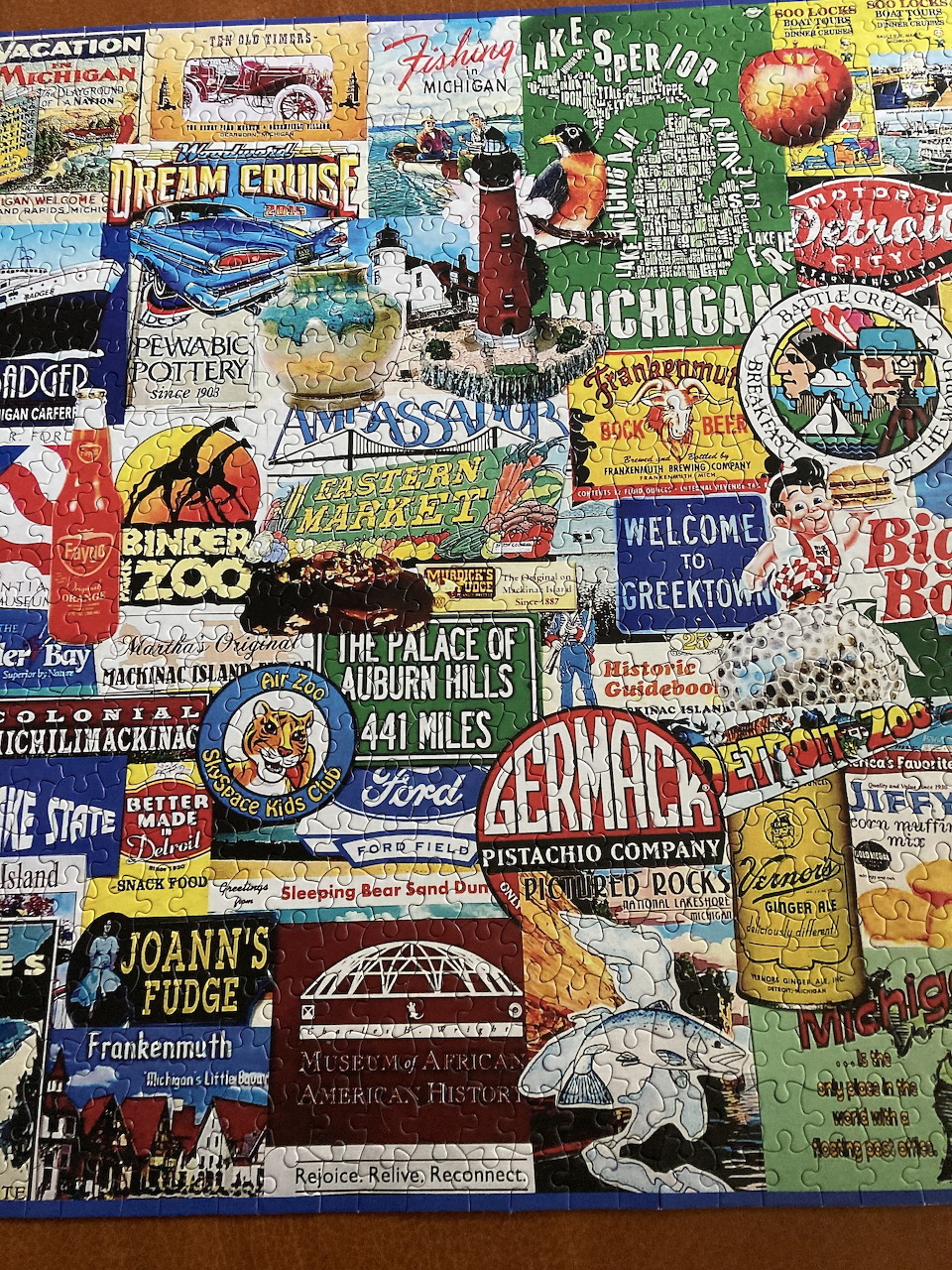 Collage of vintage Michigan tourism signs and advertisements in various colors and retro styles