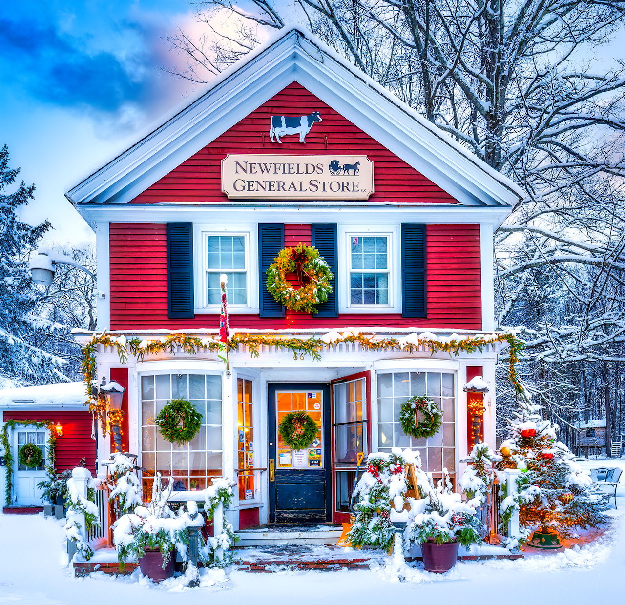 Red general store with Christmas decorations in snowy winter scene