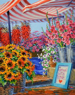 Colorful flower market stall with sunflowers and pink flowers under striped awning