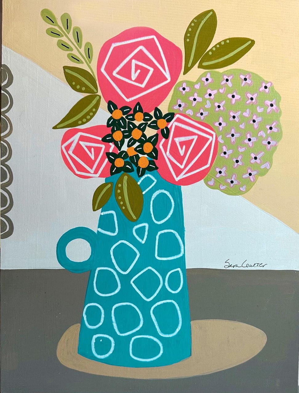 Stylized flowers in a blue patterned vase on a table