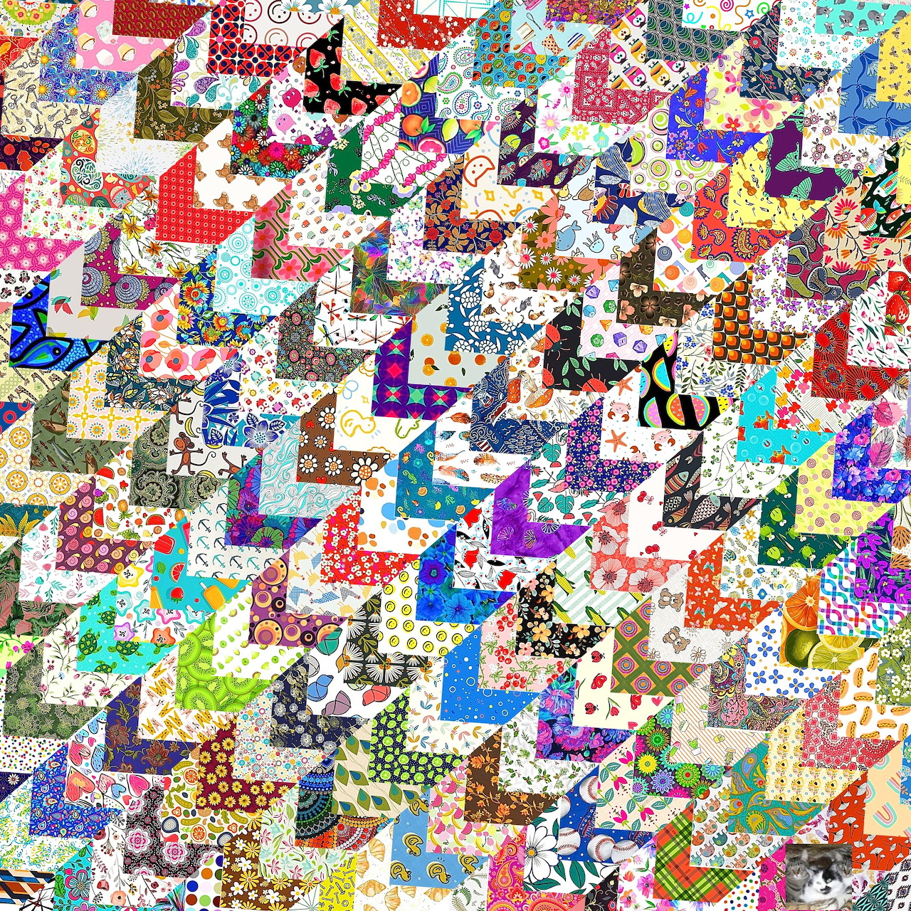 Colorful patchwork quilt with intricate geometric fabric pieces in multiple patterns and bright colors