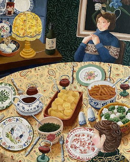 Woman in blue dress at elaborate tea party table with cakes and decorative plates