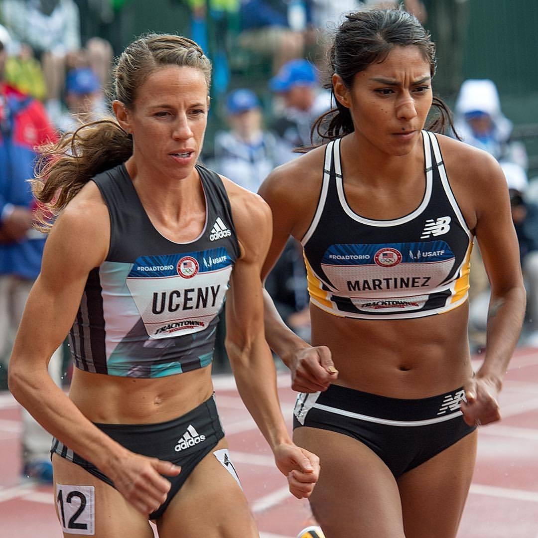 Female Track Athletes Racing