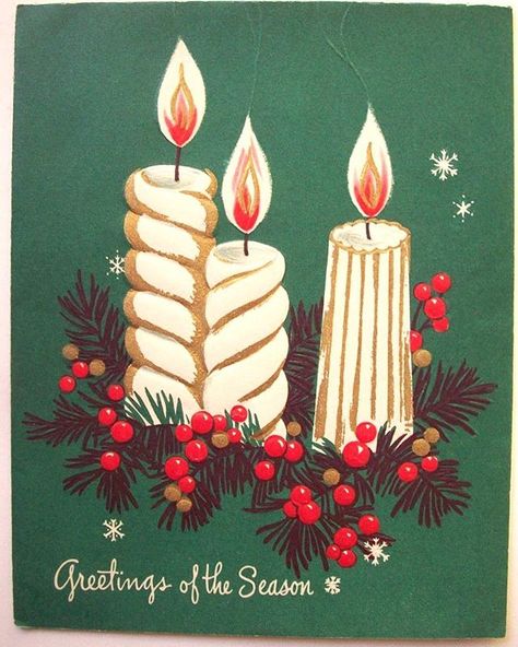 Vintage Christmas card with two lit candles, holly berries, pine branches, and snowflakes on green background