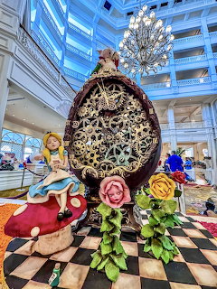 Decorative Easter egg sculpture with flowers in hotel atrium with checkered floor and blue glass architecture