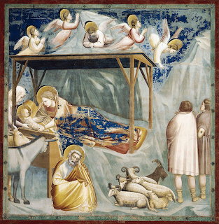 Giotto's 1305 Nativity fresco showing Mary, baby Jesus, angels, and Joseph in medieval Italian style