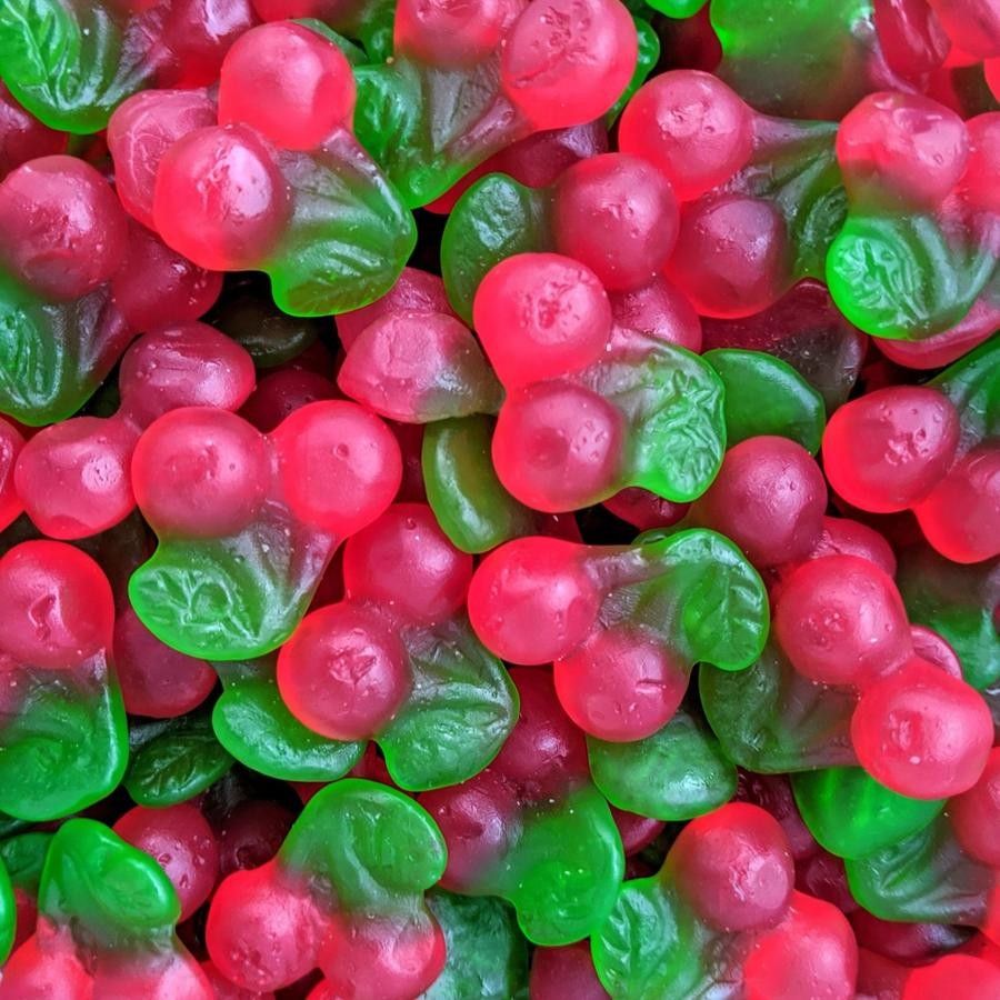 Close-up of red and green gummy candies clustered together