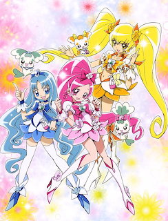 Three Heartcatch Precure magical girls in colorful costumes with fairy mascots on a bright floral background