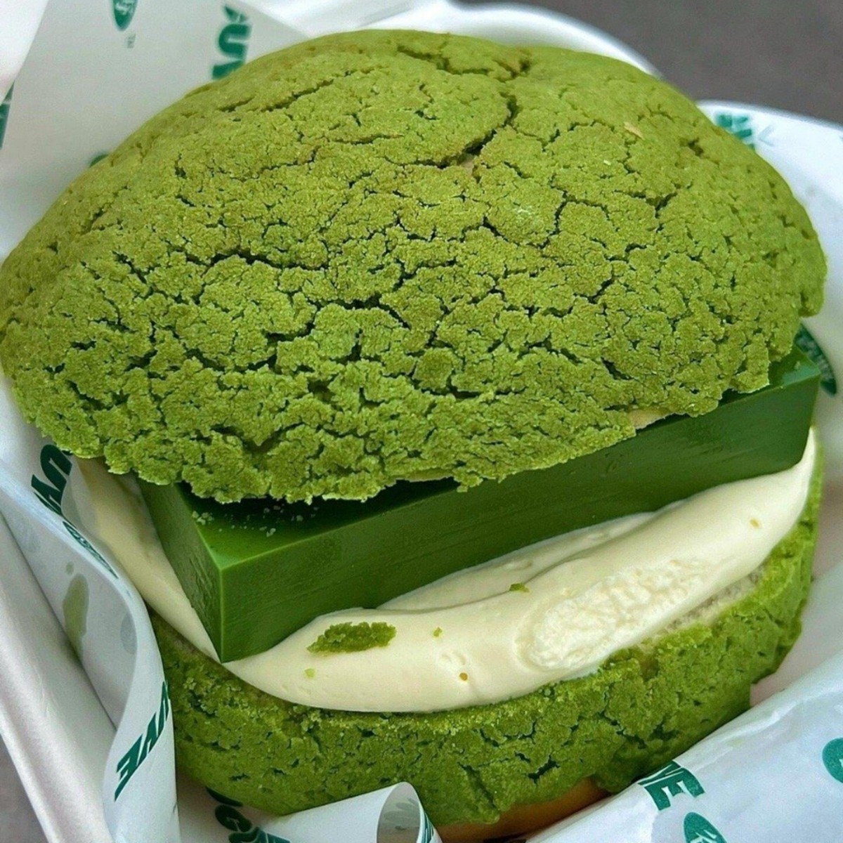 Green matcha pastry with crackled bun and thick cream filling