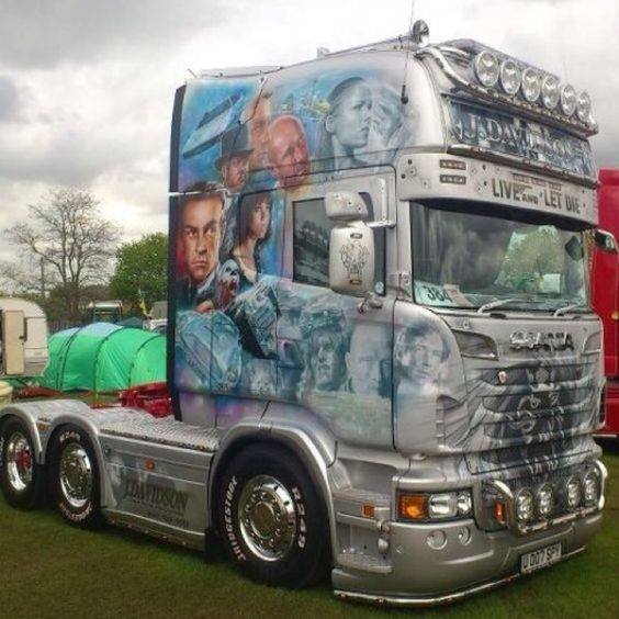 Silver Scania truck with custom airbrush portrait artwork on cab