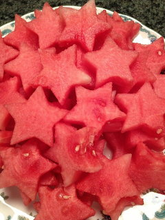 Close-up of star-shaped watermelon slices piled on a plate