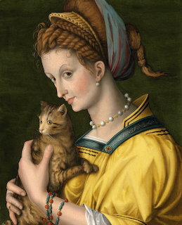 Renaissance portrait of woman in yellow dress with elaborate headdress holding orange cat