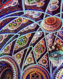 Ornate ceiling with colorful mosaic patterns in circular and curved designs