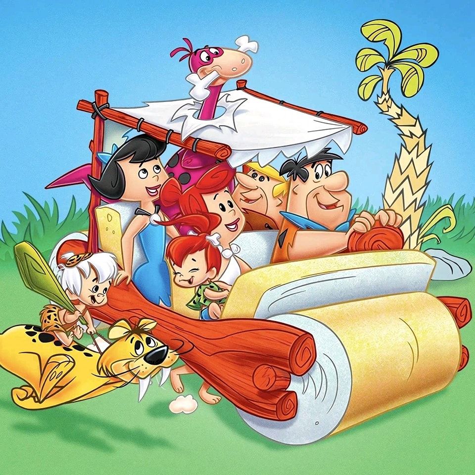 The Flintstones family in their stone-age car with Dino beside them in a colorful cartoon scene