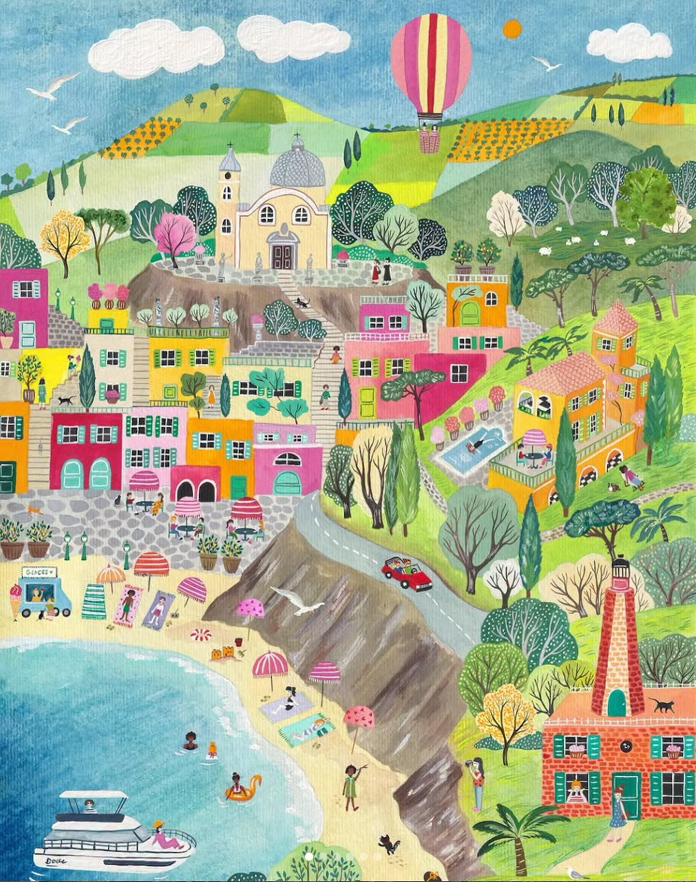 Colorful illustrated coastal village on a hillside with a beach, bright houses, and a hot air balloon