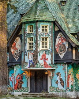 Decorated cottage house exterior with floral ornaments and seasonal decorations