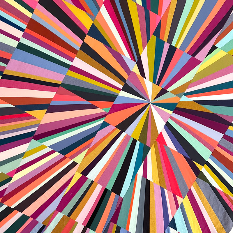 Multicolored radial burst pattern with rays emanating from center